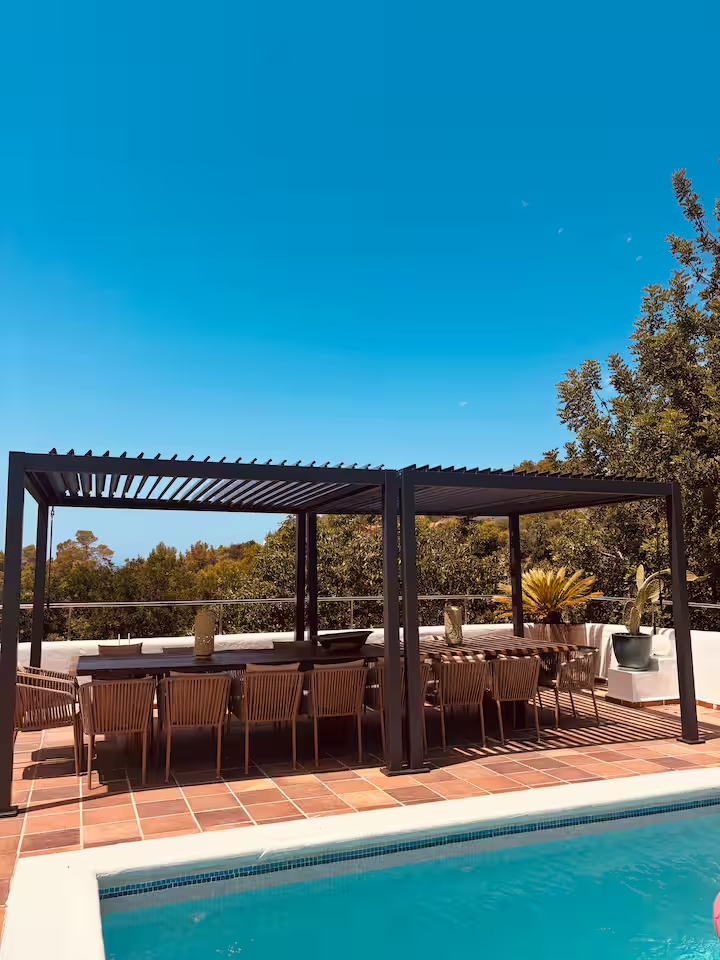 Outdoor dining pergola by the pool